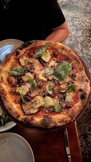 Capriccio - San Maranzo tomato, smoked hemp mozzarella, eggplant, artichokes, mushrooms, olives, garlic, topped with green vie Parmesan, basil & extra olive oil.  at Gigi Pizzeria in Newtown