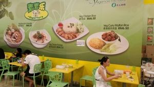 sitting area and menu on the background at Vegemore Restaurant & Food Trading 素素乐 in Johor Bahru