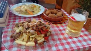 Gf got a stew, I had chips with seitan. Delicious side order of croquettes! at Somos Lo Que Comemos in Tenerife