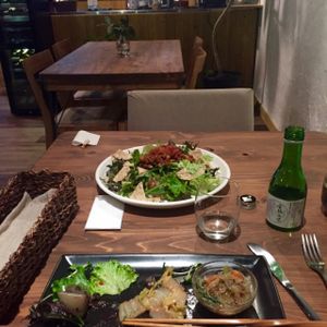 appetizers, tacorice, and sake  at Veg Out in Kyoto