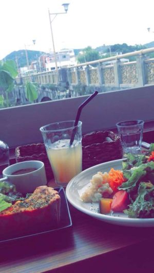 Vegan quiche and salad with ginger ale, over looking the river. at Veg Out in Kyoto