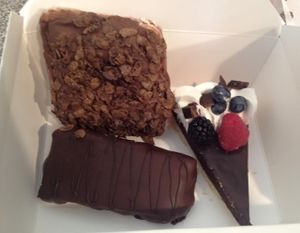 Chocolate ganache tart, cocoa pebbles donut and peanut butter chocolate and caramel bar. at Valhalla Bakery in Orlando