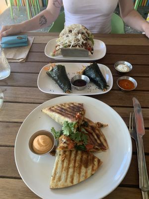 Seitan quesadilla at the front, seaweed wraps in the middle and tofu tacos other side of the table   at VegetaBowl in Koh Tao