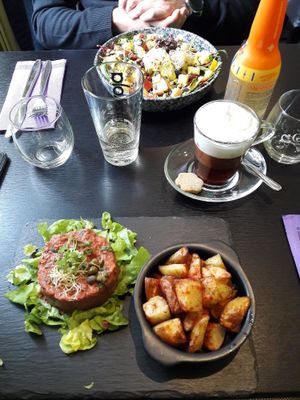 Raw salad, coffee with vegan chantilly, vegan tartare with potatoes at Velicious in Strasbourg
