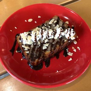 Banana bread with chocolate syrup  at Kaya Kaya Cafe in Taipei