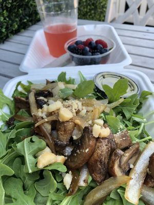 Portobello mushroom salad w side of berries & berry kombucha  at Real Raw Organics in Ocean City