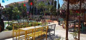 Center waterfall and dining area at EL Cafe International Vegan Food in Phan Thiet