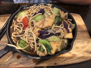 Zizlling noodles with veggies with extra tofu  at Vegeme in South Brisbane