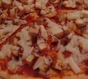 Vegan pizza, tofu and pineapple at Peace Cafe in Central Singapore