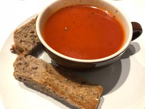 Tomato soup served with bread at Peace Cafe in Central Singapore