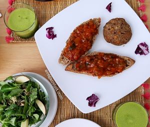 The veggie burger with ratatouille salasa, apple side salad and fresh green juice. at El Karmem in Malaga