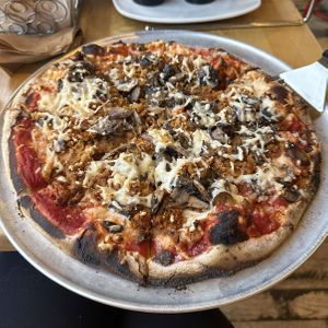 Vegan cheese, vegan sausage, wild mushroom blend pizza   at Wild Tomato Pizza in Fish Creek