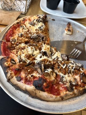 Vegan cheese, vegan sausage, wild mushroom blend pizza   at Wild Tomato Pizza in Fish Creek