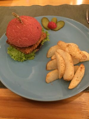 Beetroot whole wheat burger with tempeh filling and potato wedges for 58 rmb at Cloud Kitchen in Beijing