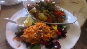 baked potato with olives and tomatoes. vegan butter on request! at Pimento Tea Rooms in Lincoln