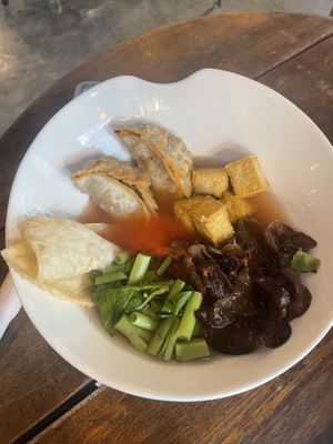 Yentafo : Thai noodle dish with Hala Chinese roots in pink broth from fermented soy bean served with konjac noodles   at Broccoli Revolution - Sukhumvit Rd in Bangkok