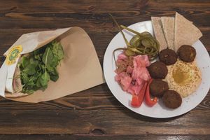 Falafel pita with guac and falafel plate with hummus at Zatar Falafel & Hummus in Vilnius