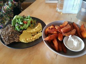 Hummus plate and sweet potato wedges with vegan aioli at The Alkaline Cafe in Albany