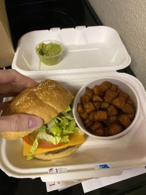 Impossible burger with daiya cheddar cheese and sweet potato bites with a side of guacamole  at New Leaf Cafe in Tampa