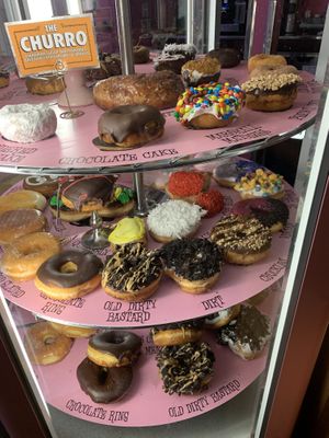 Vegan options are listed on the menu, this is the case that shows all the donuts they have (vegan isn’t listed tho)  at Voodoo Doughnuts - E 6th St in Austin