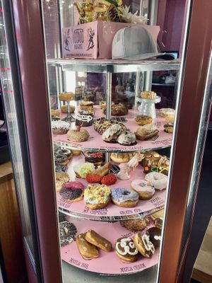 Rotating donut case  at Voodoo Doughnuts - E 6th St in Austin