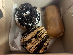 Dirt (top left), Maple Bar (right), Ol Dirty Bastard (bottom) at Voodoo Doughnuts - E 6th St in Austin