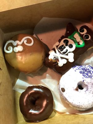 Maple with cream, strawberry fillled, chocolate cake and grape. at Voodoo Doughnuts - E 6th St in Austin