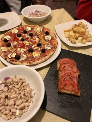 White beans. Bruschetta, Pizza without cheese, potatoes   at La Mensa del Conte in Pienza