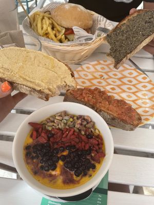 Tumeric Smoothie bowl, bruschetta“s , Burger and Fries   at H2O Juice Bar & Vegan Cafe in Fuerteventura