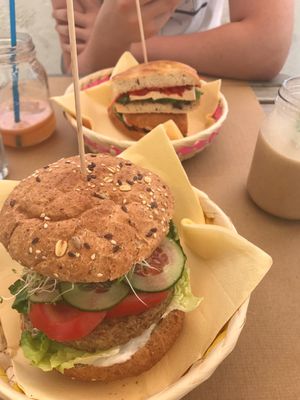 Vegan burger (mushroom) and in the background the sorrento sandwich with red pepper instead of tomato  at H2O Juice Bar & Vegan Cafe in Fuerteventura