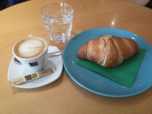 ein guter macchiato mit soyamilch und dazu ein veganes crossaint. a good macchiato with soymilk and to a vegan crossaint. at Alte Muhle in Merano