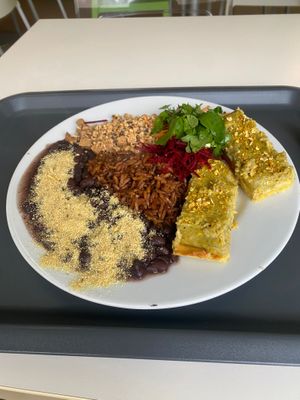 Daily menu combination with beans, tofu, brown rice, corn cake and salad at Escolha Natura in Lisbon