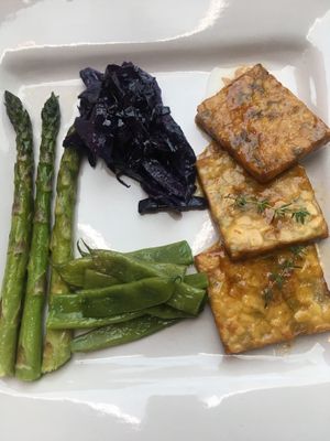 Homemade glazed pea and soy tempeh with vegetables  at Il Cardo e l'Ortica in Mondovi