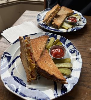 Vegan deluxe grilled cheese (split 3 sandwiches between the 2 of us hence 1.5 halves on the plate)  at Fine Grind Cafe in St Catharines