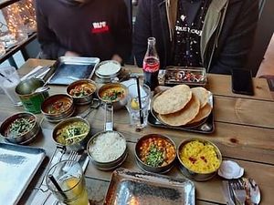 I chose the vegan pot-luck Tiffin Four Tiers (a mixture of carbs and curry that they choose for you!). Everything they brought tasted amazing.  at Mowgli in Manchester