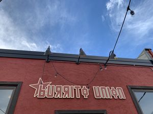 Sign on the outdoor patio  at Burrito Union in Duluth