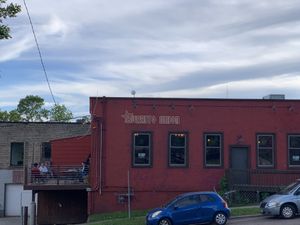 Side of the building with outdoor seating on the back patio  at Burrito Union in Duluth