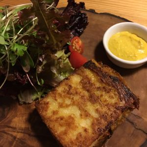 Corn pie starter with black mushrooms and tomato ragu at La Verde in Lima