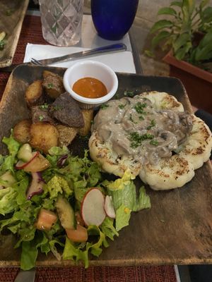 Cauliflower steak with gravy  at Vivo Cafe & Restaurant in West Bay