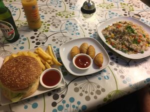 Chicken burger, curry puffs and fried rice! at Inala Vegan Restaurant in Inala