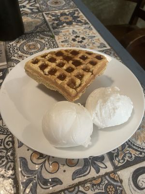 vanilla ice cream with waffles and maple syrup. The ice cream is usually quite decent but this time was very sandy texture   at Terrasen Cafe in Hyderabad