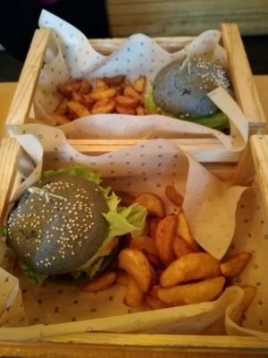 Delicious Black Bun Burger at Flower Burger - Viale Vittorio Veneto in Milan