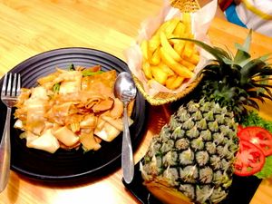 French fries, char kway teow and curry pineapple rice. at Cuisine Viet & Lantern Lounge  in Hanoi