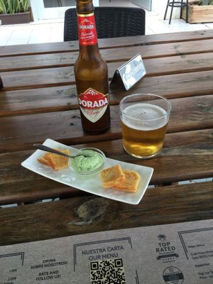 Little appetizers served with our pre-meal drinks : chick pea omelette and alioli at BuenaVida Vegan in Tenerife