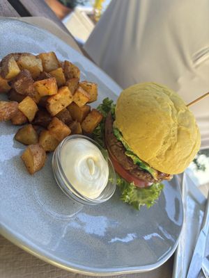 Lentil burger with baked potato’s   at BuenaVida Vegan in Tenerife