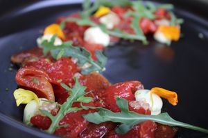 Carpaccio de sandía braseada, con mayonesa de pimienta rosa, limon caviar, rucula y lime zest at BuenaVida Vegan in Tenerife