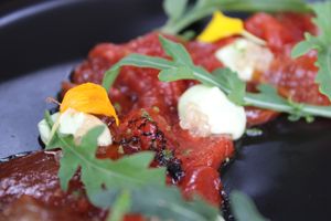 Carpaccio de sandía braseada, con mayonesa de pimienta rosa, limon caviar, rucula y lime zest at BuenaVida Vegan in Tenerife