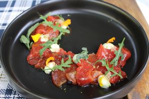 Carpaccio de sandía braseada, con mayonesa de pimienta rosa, limon caviar, rucula y lime zest at BuenaVida Vegan in Tenerife