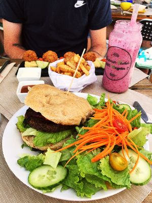 quinoa burger with salad, falafels, chips and wild berry smoothie at BuenaVida Vegan in Tenerife