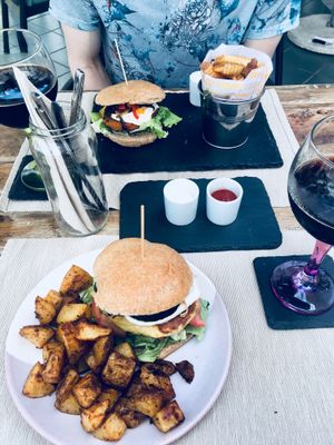 Burger with fried potatoes  at BuenaVida Vegan in Tenerife